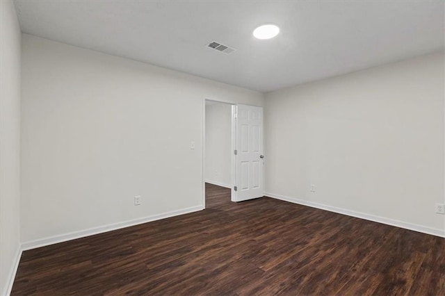 2091 Chestnut Log Dr, Lithia Springs, GA 30122 - spare room featuring dark wood finished floors and baseboards