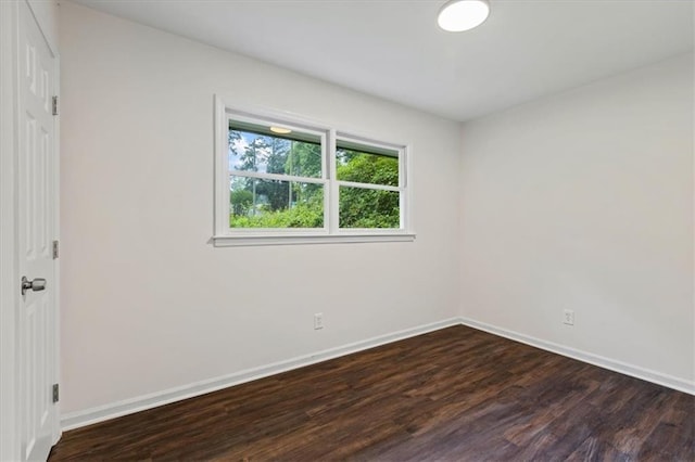 2091 Chestnut Log Dr, Lithia Springs, GA 30122 - unfurnished room with dark wood-style flooring and baseboards
