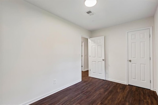 2091 Chestnut Log Dr, Lithia Springs, GA 30122 - unfurnished bedroom with dark wood finished floors and baseboards