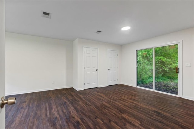 2091 Chestnut Log Dr, Lithia Springs, GA 30122 - spare room featuring dark wood-style flooring and baseboards