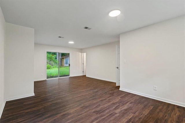 2091 Chestnut Log Dr, Lithia Springs, GA 30122 - unfurnished room with baseboards, dark wood-style floors, and recessed lighting