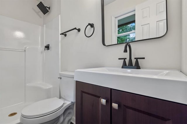 2091 Chestnut Log Dr, Lithia Springs, GA 30122 - bathroom featuring toilet, vanity, and a shower