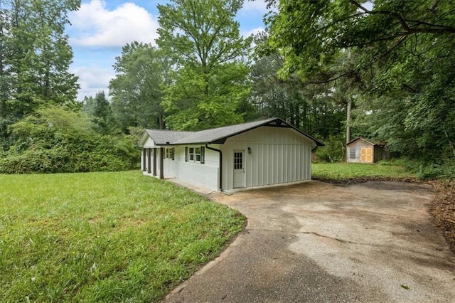 2091 Chestnut Log Dr, Lithia Springs, GA 30122 - view of shed with asphalt driveway