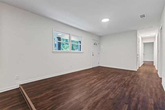 2091 Chestnut Log Dr, Lithia Springs, GA 30122 - spare room featuring dark wood-type flooring and baseboards