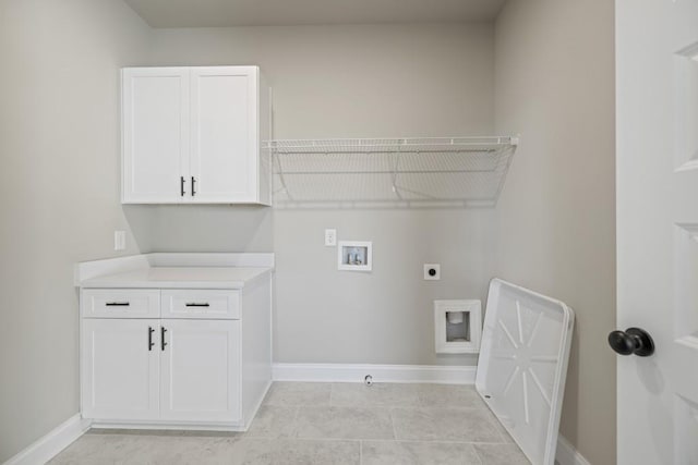 laundry room featuring cabinets, electric dryer hookup, hookup for a washing machine, and light tile patterned flooring