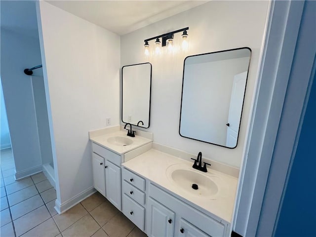 bathroom featuring double vanity and tile patterned flooring