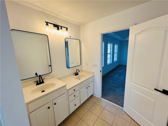 bathroom featuring tile patterned floors and dual bowl vanity