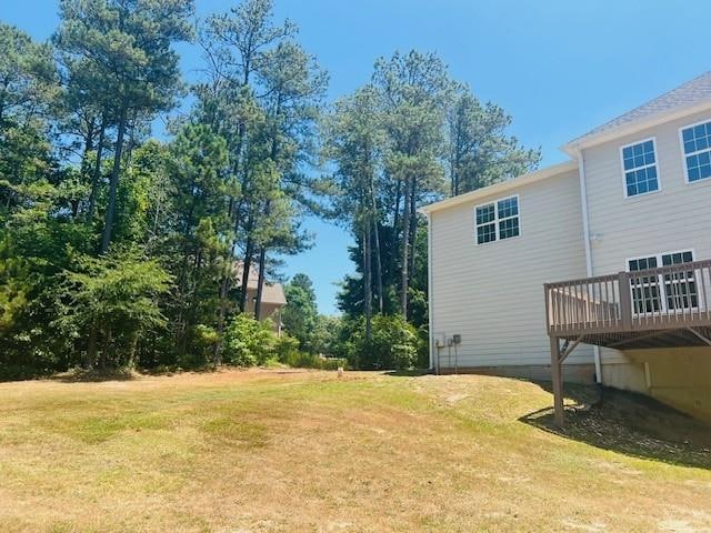 view of yard featuring a wooden deck