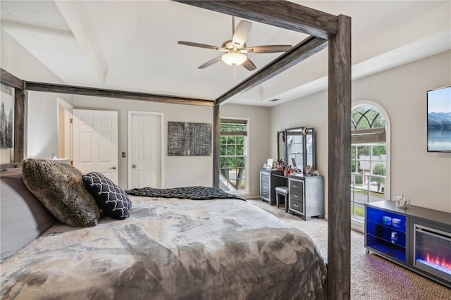 bedroom featuring multiple windows, carpet, and ceiling fan