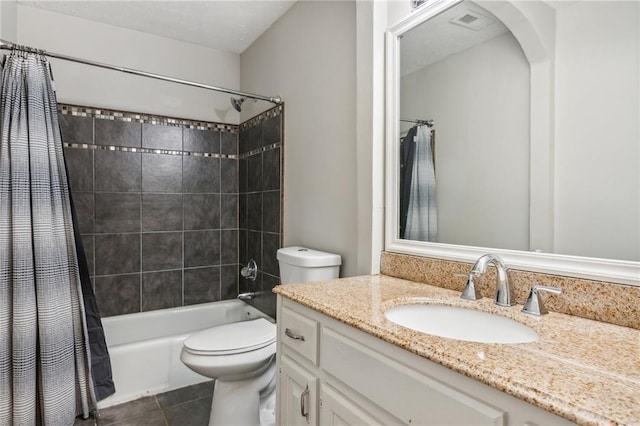 full bathroom featuring toilet, shower / bath combo with shower curtain, vanity, and tile patterned floors