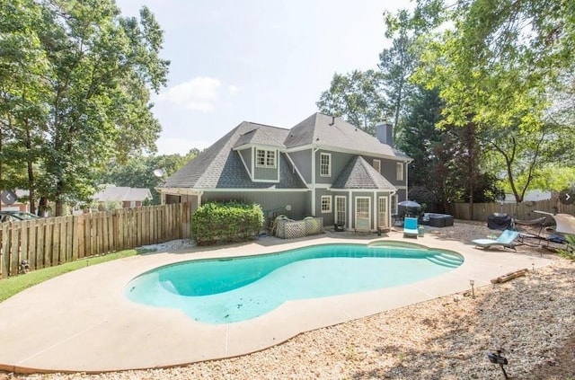 view of pool with a patio and a fenced backyard