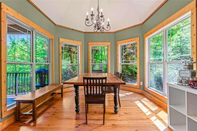 210 Lake Pines Rd, Jackson, GA 30233 - sunroom / solarium with plenty of natural light, a chandelier, hardwood / wood-style floors, a wooden deck, and crown molding