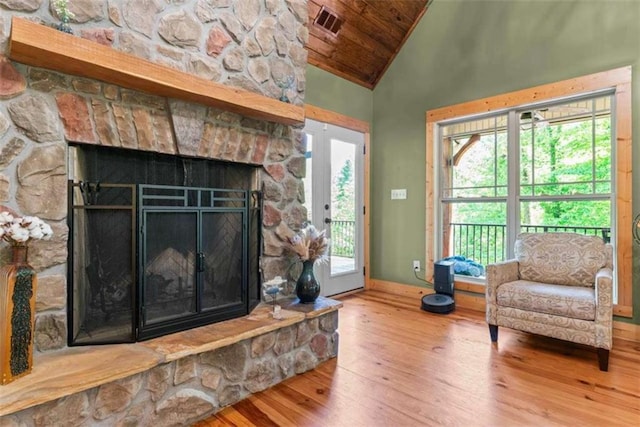 210 Lake Pines Rd, Jackson, GA 30233 - living area featuring hardwood / wood-style floors, wooden ceiling, baseboards, high vaulted ceiling, and a fireplace
