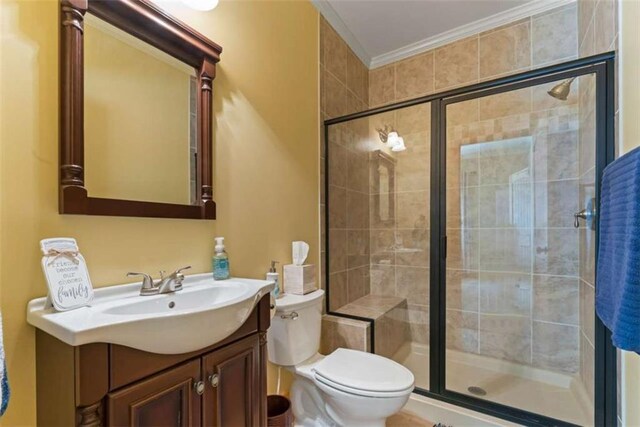 210 Lake Pines Rd, Jackson, GA 30233 - full bath with toilet, vanity, a stall shower, and crown molding