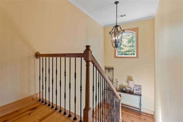 210 Lake Pines Rd, Jackson, GA 30233 - stairs with a chandelier, wood finished floors, and ornamental molding