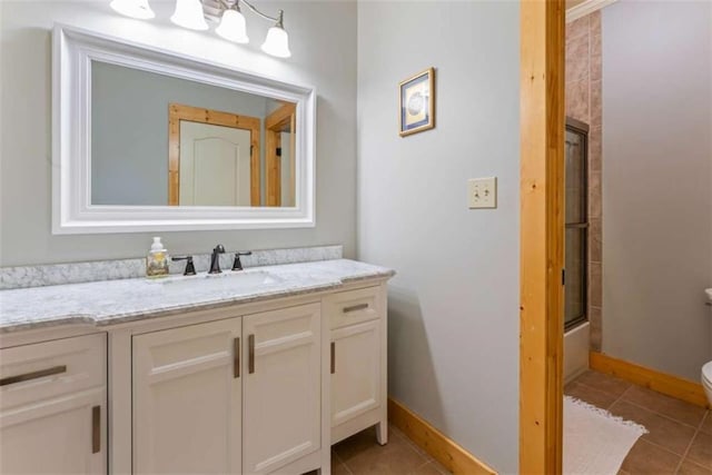 210 Lake Pines Rd, Jackson, GA 30233 - bathroom featuring toilet, vanity, baseboards, and tile patterned flooring