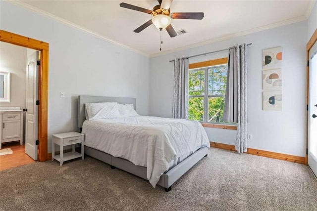 210 Lake Pines Rd, Jackson, GA 30233 - bedroom with ornamental molding, carpet floors, baseboards, ceiling fan, and ensuite bathroom