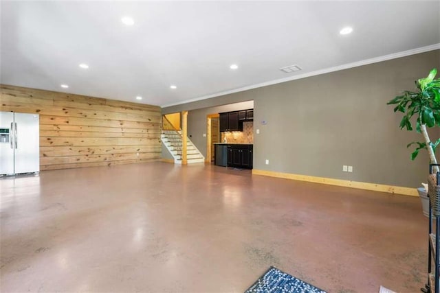 210 Lake Pines Rd, Jackson, GA 30233 - unfurnished living room featuring concrete flooring, recessed lighting, stairway, crown molding, and baseboards