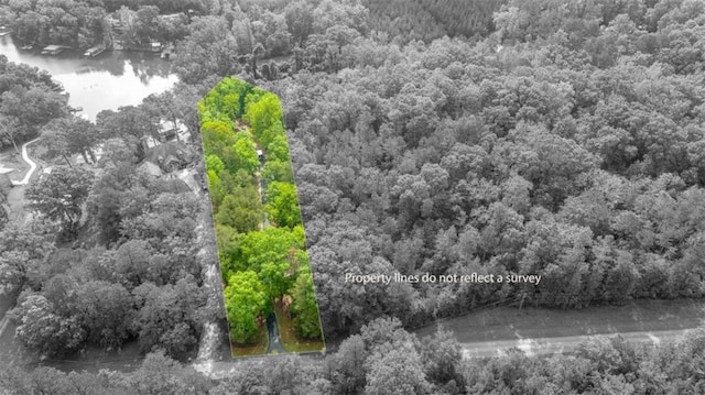 210 Lake Pines Rd, Jackson, GA 30233 - aerial view of property's location with property parcel outlined, a large body of water, and a heavily wooded area