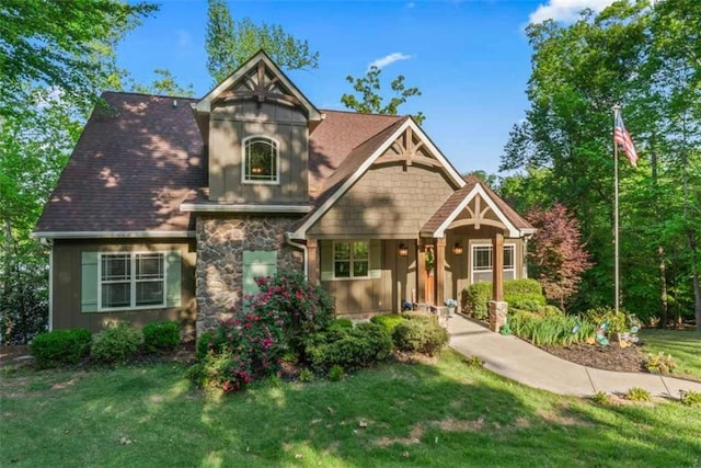 210 Lake Pines Rd, Jackson, GA 30233 - view of front of home with a front lawn, stone siding, and covered porch
