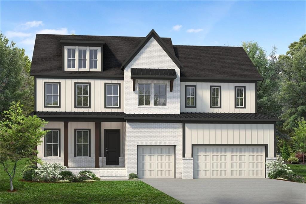 view of front of home with board and batten siding, an attached garage, driveway, brick siding, and a front yard