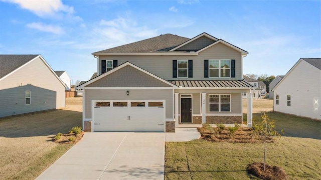 craftsman inspired home with a front yard and a garage