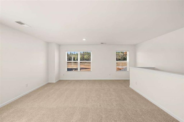 empty room with light colored carpet