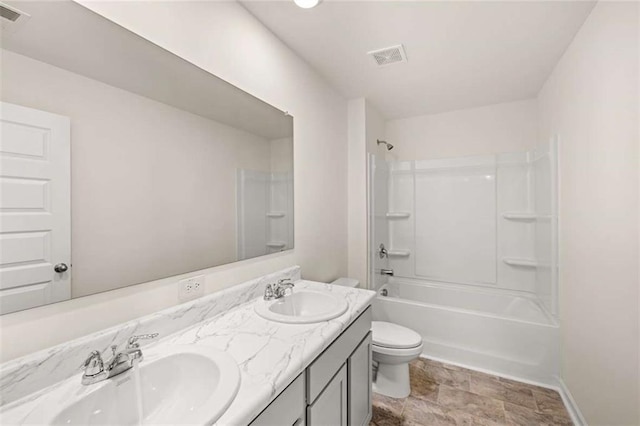 full bathroom featuring vanity, toilet, and tub / shower combination