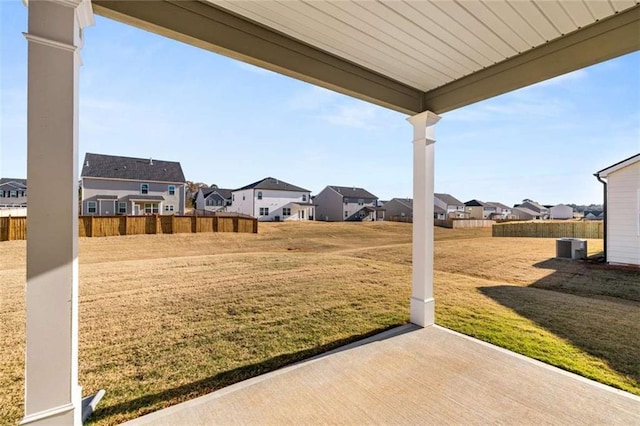 view of yard with central AC and a patio area