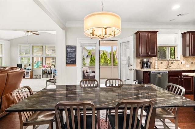 337 Spotted Ridge Cir, Woodstock, GA 30188 - dining area featuring a ceiling fan, a chandelier, and ornamental molding