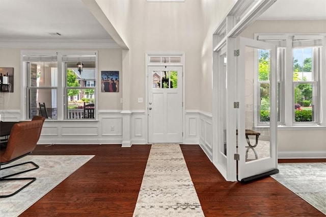 337 Spotted Ridge Cir, Woodstock, GA 30188 - entryway with dark wood-type flooring, crown molding, a wainscoted wall, and a decorative wall
