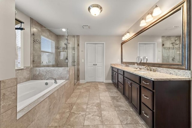 337 Spotted Ridge Cir, Woodstock, GA 30188 - bathroom with a bath, a stall shower, double vanity, and baseboards