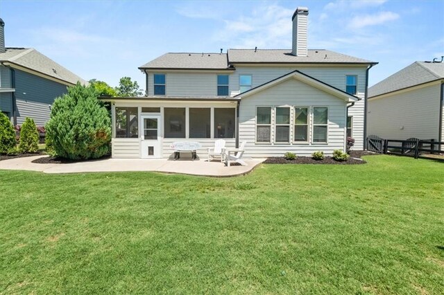 337 Spotted Ridge Cir, Woodstock, GA 30188 - back of house featuring a sunroom, a patio area, and a chimney