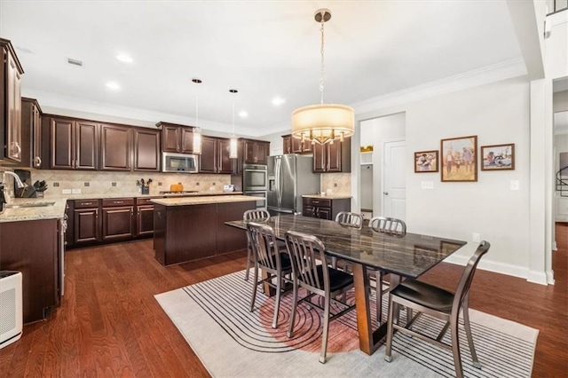 337 Spotted Ridge Cir, Woodstock, GA 30188 - dining space featuring crown molding, dark wood-style flooring, recessed lighting, and baseboards