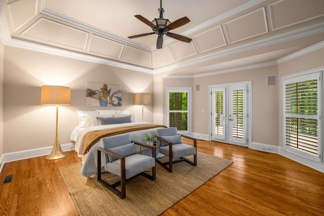 bedroom with crown molding, access to exterior, baseboards, wood finished floors, and ceiling fan