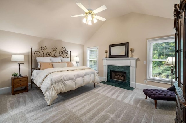 bedroom with carpet, vaulted ceiling, multiple windows, and baseboards