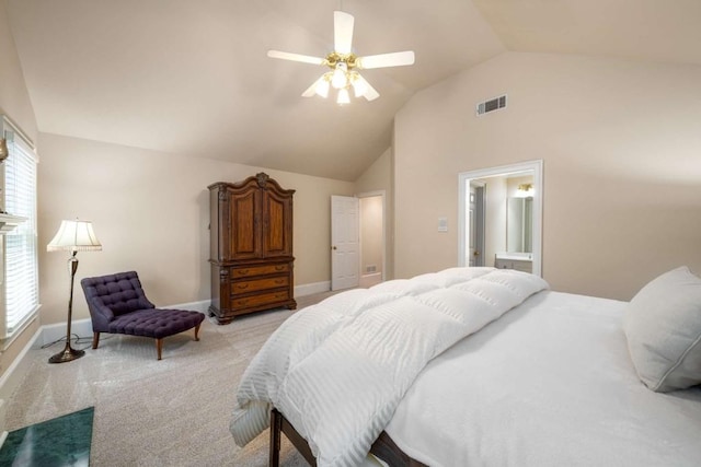 bedroom featuring vaulted ceiling, light colored carpet, baseboards, ceiling fan, and connected bathroom