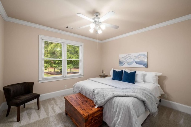 bedroom with carpet floors, baseboards, crown molding, and a ceiling fan