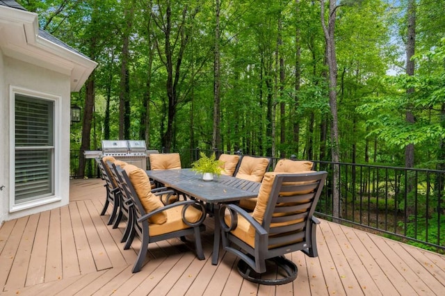 wooden deck featuring outdoor dining area