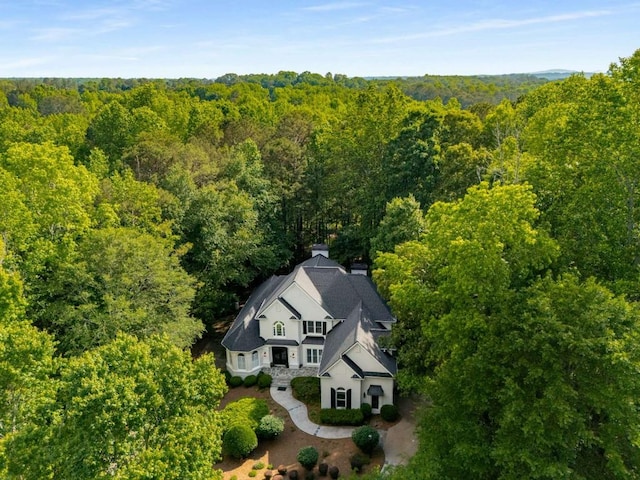 view from above of property featuring a forest