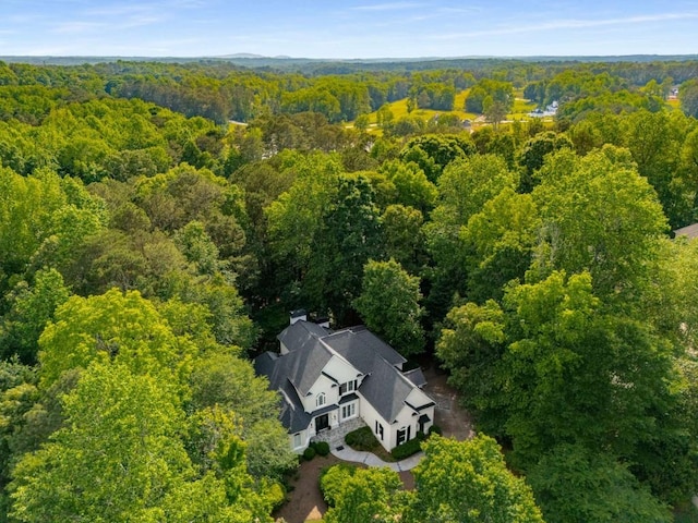 view from above of property featuring a forest