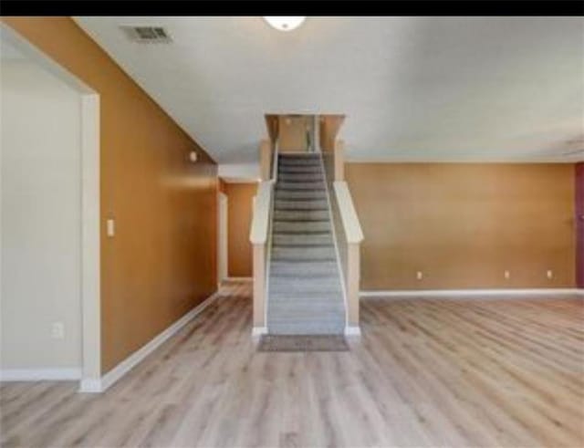 6684 Crane Ave, Fairburn, GA 30213 - stairs featuring wood finished floors and baseboards
