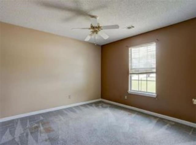 6684 Crane Ave, Fairburn, GA 30213 - carpeted empty room featuring baseboards, ceiling fan, and a textured ceiling