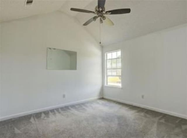 6684 Crane Ave, Fairburn, GA 30213 - spare room with baseboards, carpet flooring, lofted ceiling, and a ceiling fan