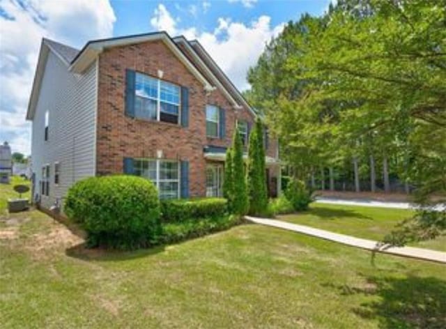 6684 Crane Ave, Fairburn, GA 30213 - view of front of house with a front lawn and brick siding