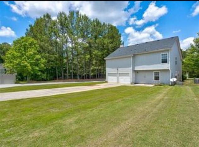 6684 Crane Ave, Fairburn, GA 30213 - view of property exterior with concrete driveway and a yard