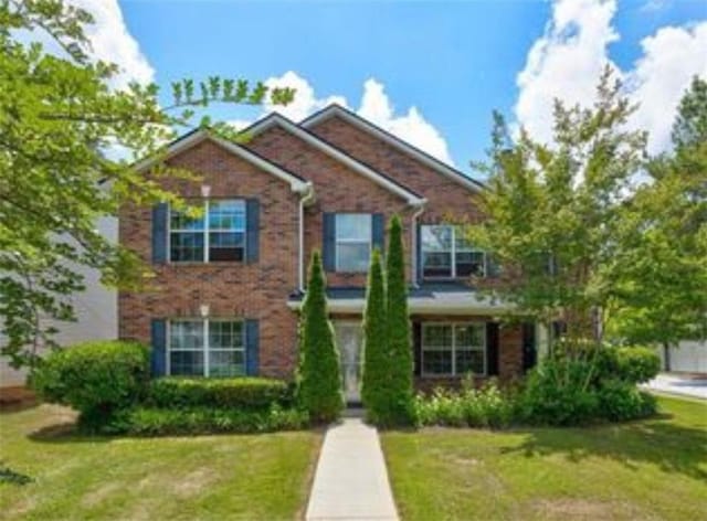 6684 Crane Ave, Fairburn, GA 30213 - traditional home featuring a front yard and brick siding