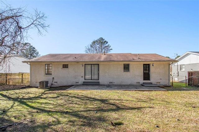 rear view of house featuring central AC, a yard, and a patio