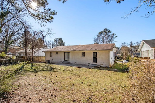 back of house with a patio area, a yard, and central air condition unit