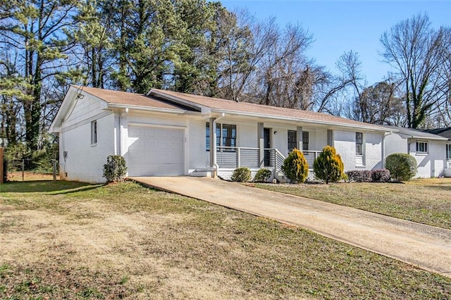 single story home with a garage, a front yard, and covered porch